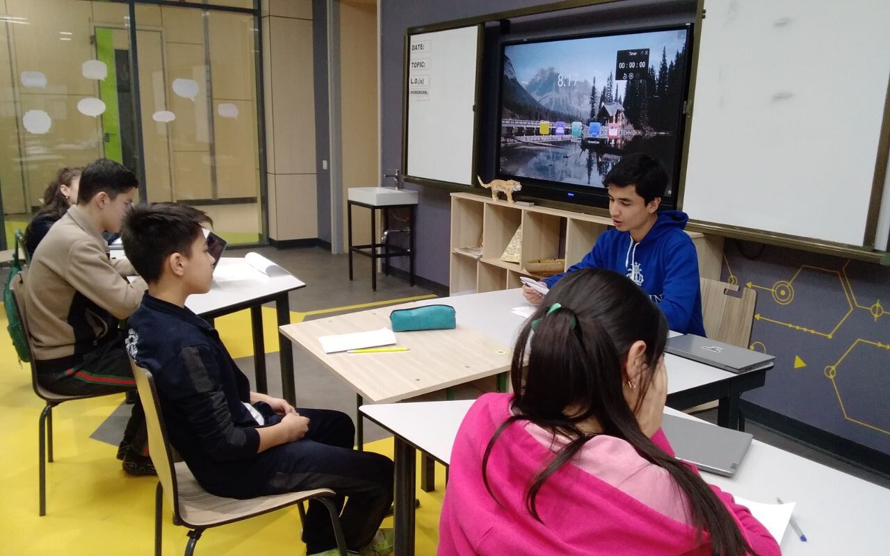 Mentoring students at a desk